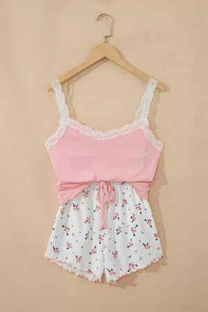 Pink lace-trimmed cami pajama set with white floral print drawstring shorts