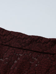 Sheer lace one-shoulder top in burgundy with floral pattern.