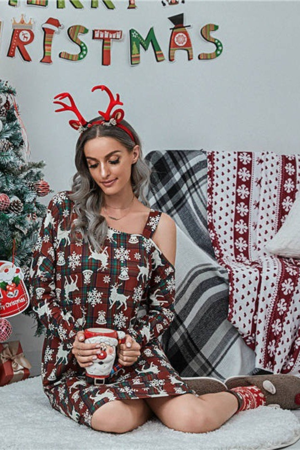 Cold shoulder festive dress in wine with reindeer and snowflake print, plaid pattern, long sleeves.