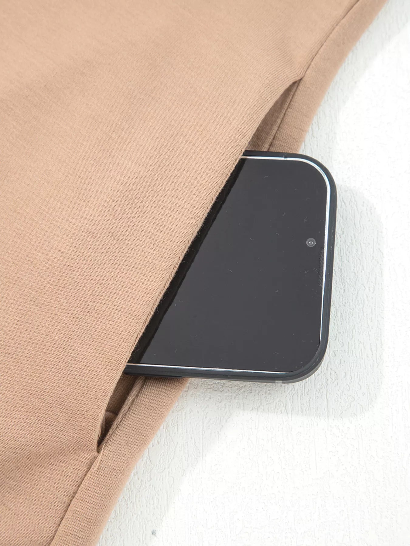 Braided Puff Sleeve Dress in Khaki with a phone in the side pocket.