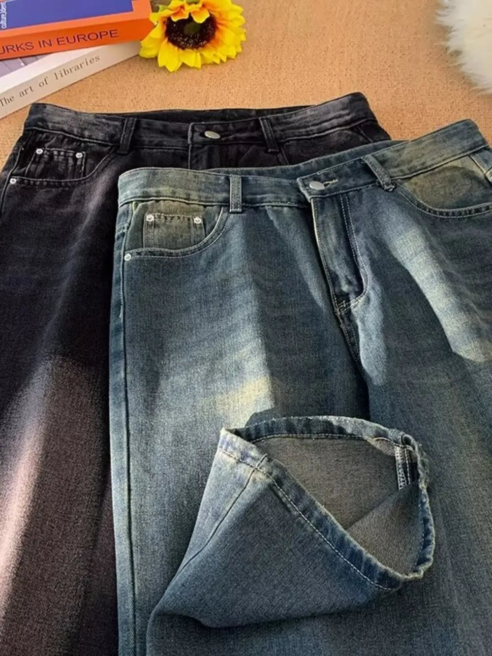 Men's plus-size wide-leg jeans in medium wash and black vintage denim.