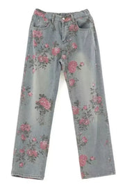 Maternity wide-leg jeans in light wash denim with an all-over pink floral print.