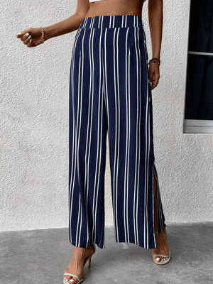 Dark blue vertical stripe palazzo trousers with slit legs and button detail.