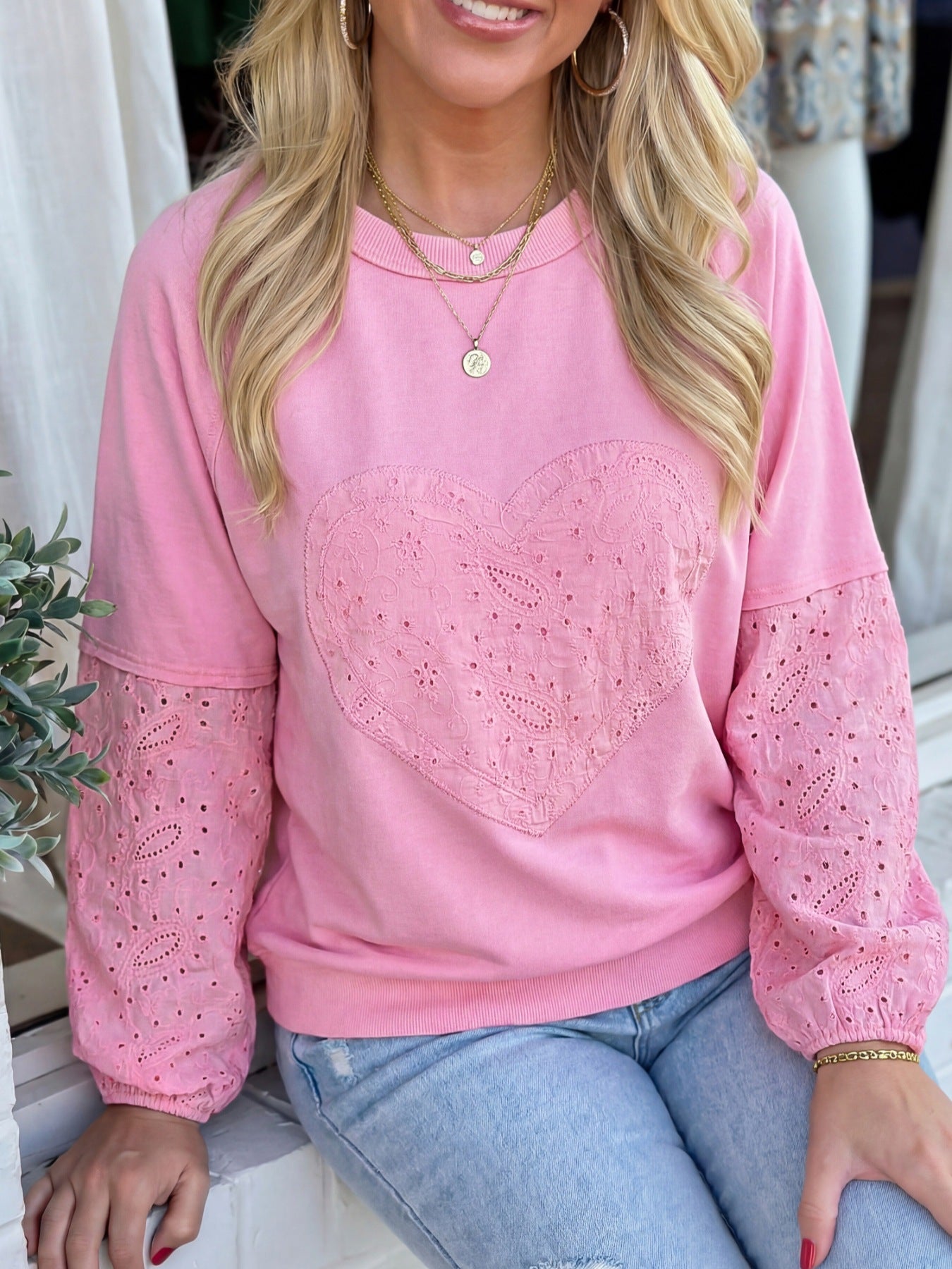 Pink cotton crew-neck sweatshirt with embroidered heart detail and eyelet sleeves