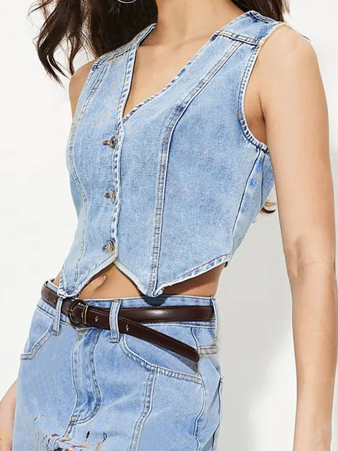 Light wash denim cropped bustier vest with button front and V-neckline.