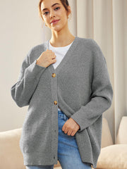 Gray ribbed knit cardigan with balloon sleeves and button front, styled casually.