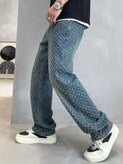 Relaxed fit jeans in blue denim with a textured pattern.