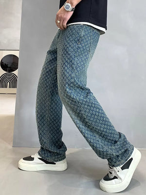 Relaxed fit jeans in blue denim with a textured pattern.