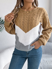 Chevron cable knit sweater in camel, white, and grey with a crew neck.
