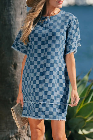 Denim mini dress with checkered pattern, frayed hems, and short sleeves.