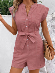 Dusty pink striped shirtdress romper with button front, tie waist, and pockets.