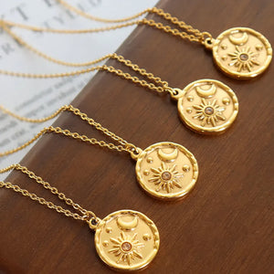 Gold zirconia coin necklace with sun and moon design