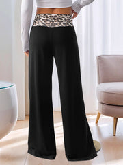 Black wide leg trousers with a leopard print waistband