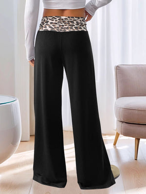 Black wide leg trousers with a leopard print waistband
