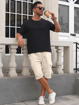 Khaki relaxed fit drawstring cargo shorts with utility pockets.