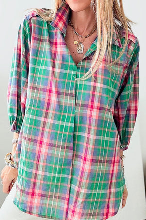 Voluminous plaid blouse with gathered sleeves and a v-neck, featuring green, pink, and purple plaid.