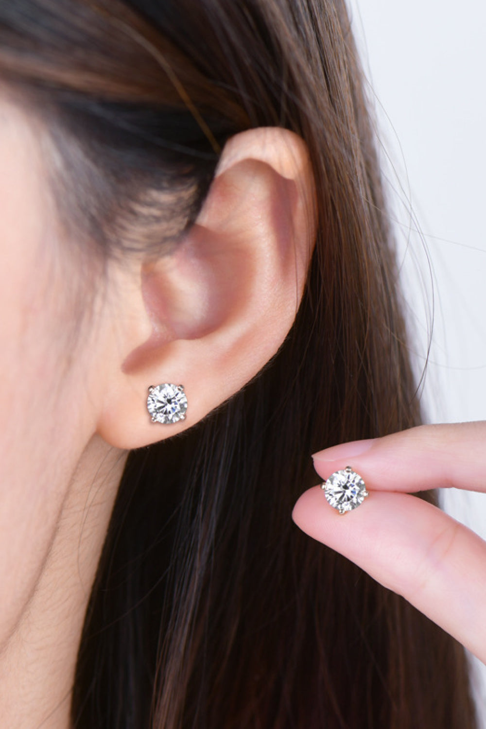 Sterling silver moissanite solitaire stud earrings with a brilliant cut.