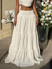 White tiered maxi skirt with smocked waist and crinkled texture