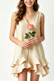 Tiered ruffle hem mini dress in beige with V-neck and sleeveless design.
