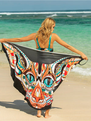 Black pareo wrap with a colorful abstract cat face graphic, perfect for beachwear.