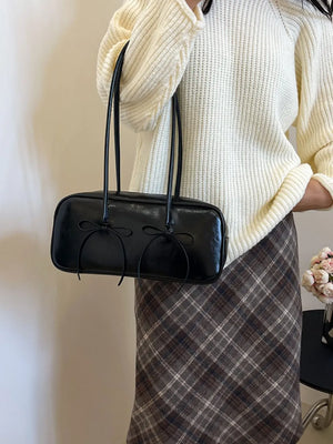 Black patent leather shoulder bag with bow details