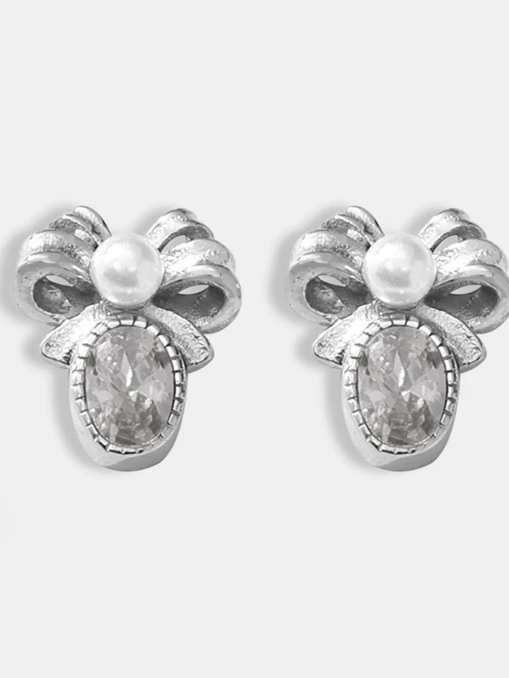Silver bow stud earrings with pearl and oval crystal detail