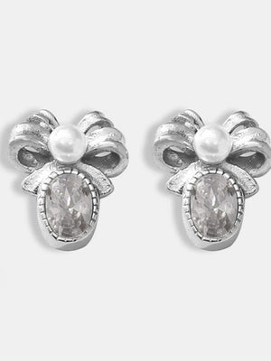 Silver bow stud earrings with pearl and oval crystal detail