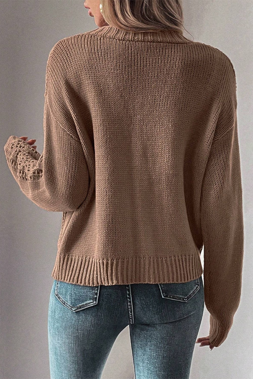 Taupe knit cardigan with mesh detail on sleeves and ribbed cuffs.