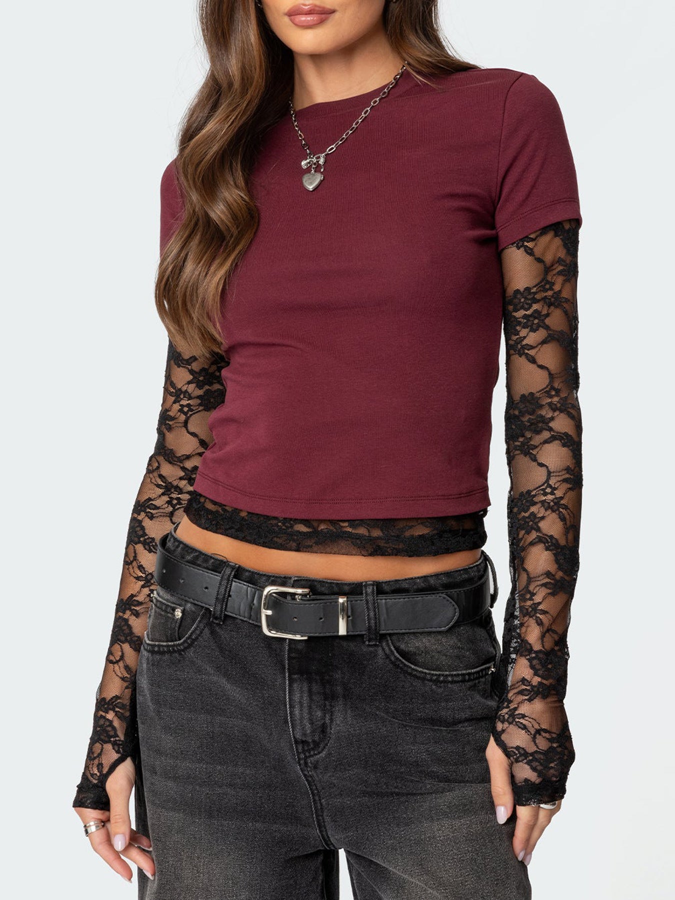 Wine red cropped t-shirt with black lace long sleeves and lace trim detail.