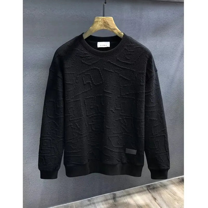 Black crewneck sweatshirt with embossed geometric texture, crew neck, long sleeves, and ribbed cuffs and hem.