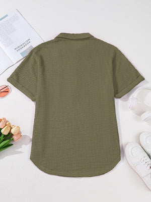 Moss waffle-knit collared shirt with short sleeves and button detail.