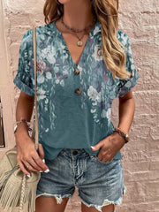 Bohemian tapestry henley blouse in French Blue with floral print, v-neck, and button detail.