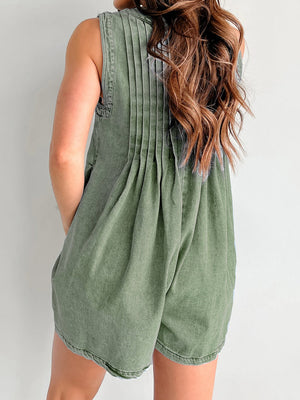 Moss green denim playsuit with back pleats and A-line shorts.