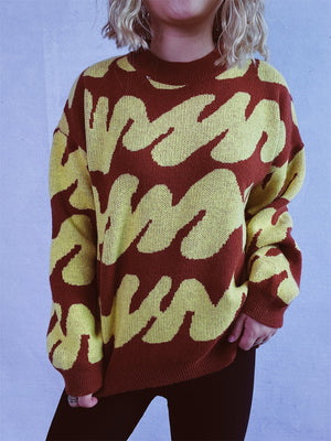 Graphic Wave Knit Sweater in Dark Brown and Light Yellow with crew neck and long sleeves.