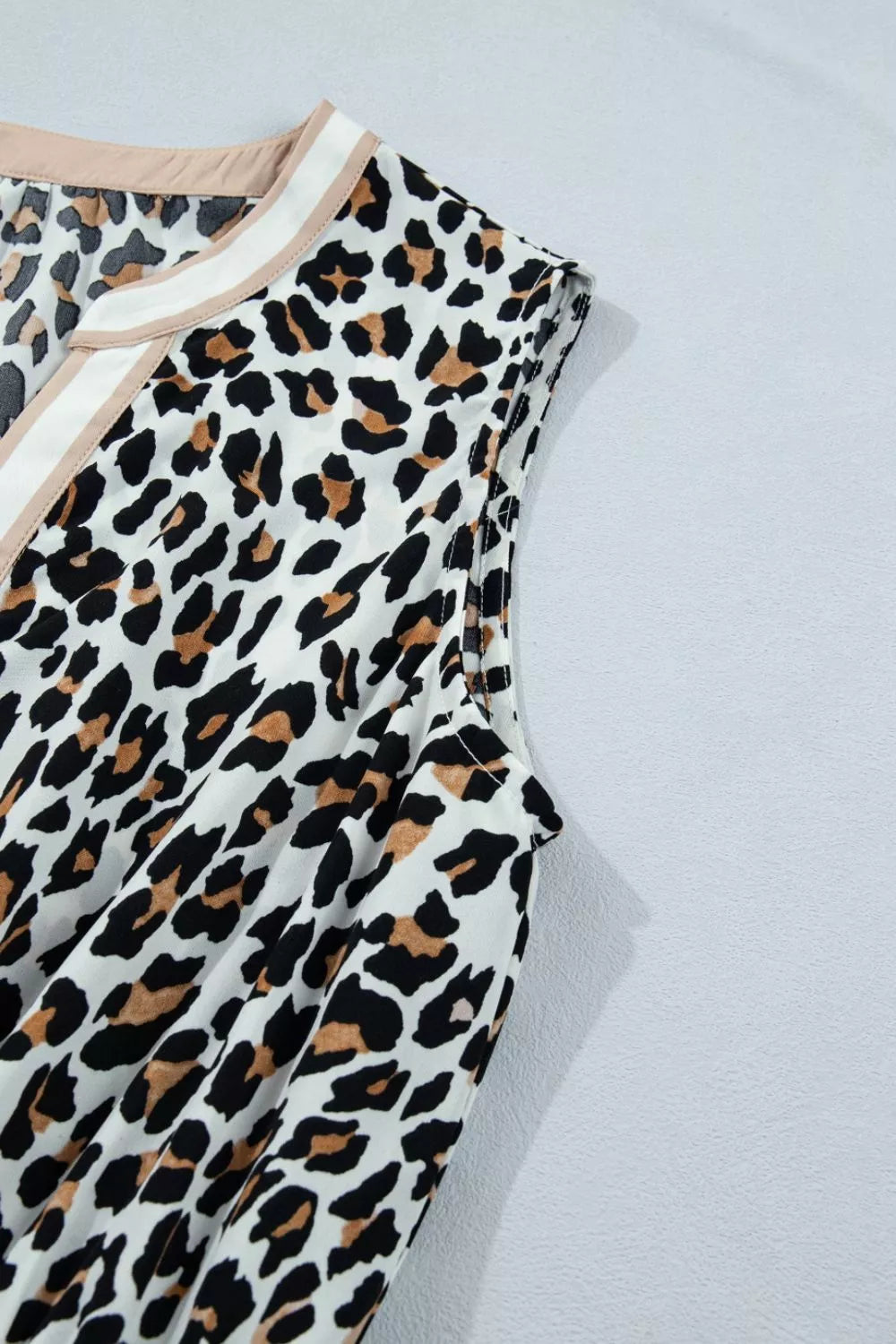 Leopard print midi dress with colorblock neckline detail.