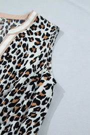 Leopard print midi dress with colorblock neckline detail.