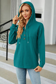 Textured henley hooded knit top in Deep Teal with button detail and drawstring hood.