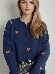 Dark blue zip-through knit cardigan with allover orange heart print, acrylic.