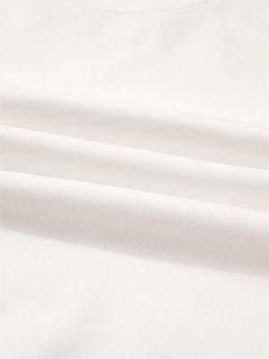 White cotton pullover fabric detail, soft and comfortable loungewear material.