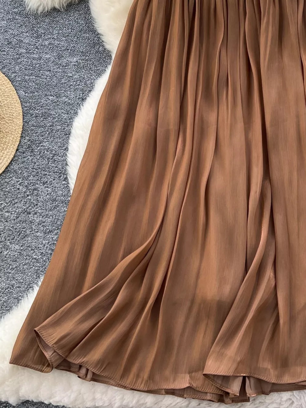 Brown pleated maxi skirt with flowy fabric detail