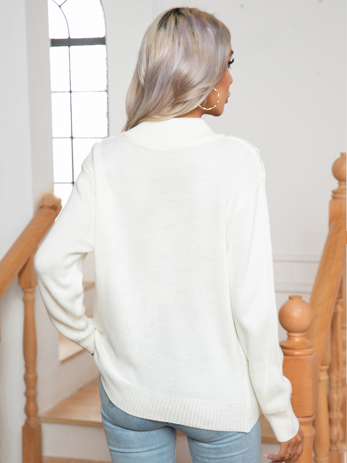 White argyle cable-knit mock neck sweater with ribbed cuffs and hem.