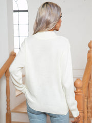White argyle cable-knit mock neck sweater with ribbed cuffs and hem.