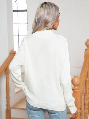 White argyle cable-knit mock neck sweater with ribbed cuffs and hem.