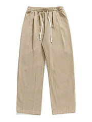 Khaki wide-leg pleated trousers with drawstring waist and pockets