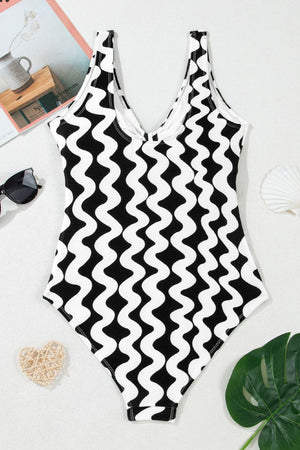 Black and white wave print one-piece swimsuit with bow-front detail
