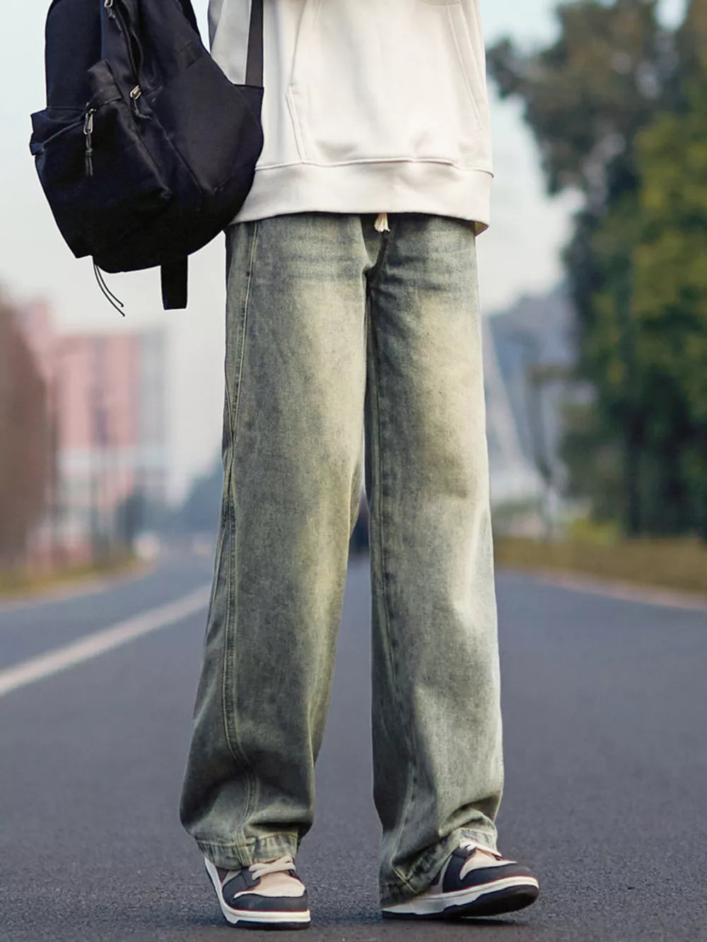 Relaxed fit 100 cotton jeans in a light wash with a drawstring waist.