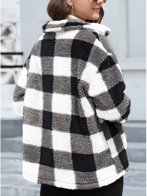 Plaid sherpa overshirt jacket in black and white buffalo check with a fuzzy texture.
