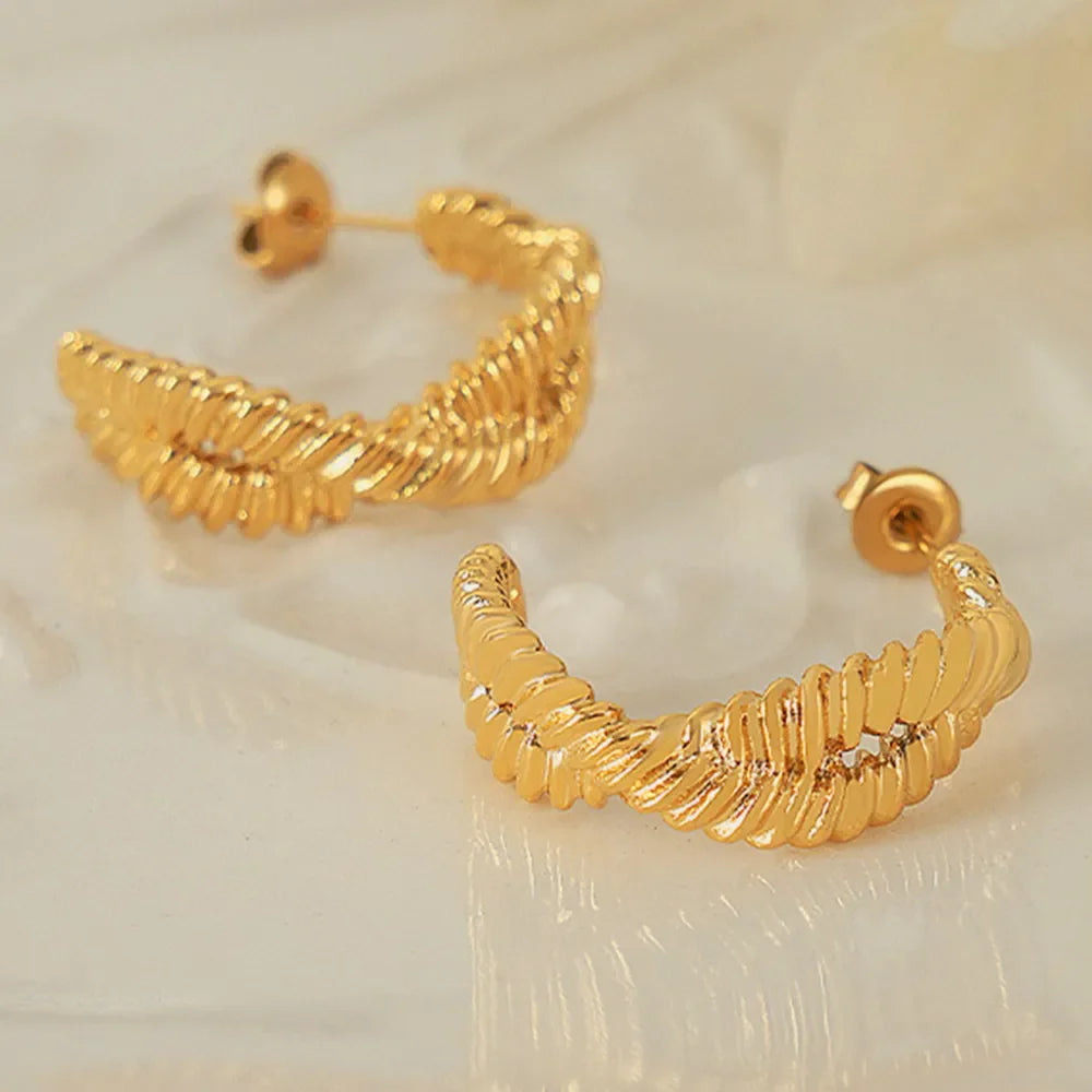 Gold vermeil braided hoop stud earrings with a textured design.