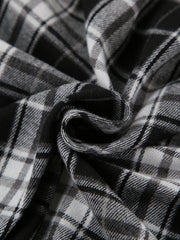 Oversized button-up shirt in black and white plaid cotton fabric.