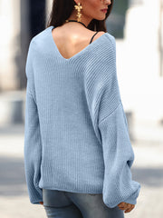 Pastel blue slouchy knit sweater with V-neck and balloon sleeves